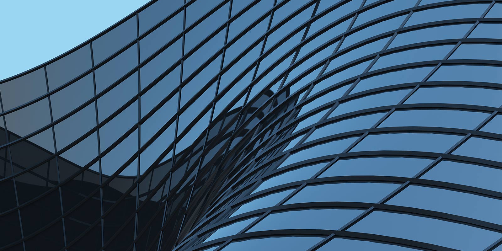 Close-up of curved glass panels on a modern building.